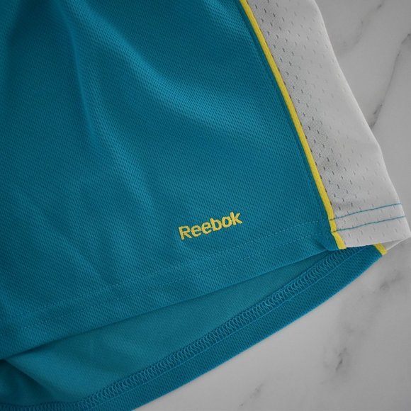 Reebok teal athletic shorts with yellow and white mesh stripes Y2K vibes - Picture 2 of 4